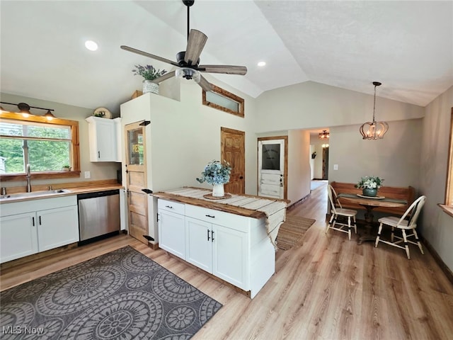 12779 State Route 700, Hiram, OH 44234 - kitchen with stainless steel dishwasher, a peninsula, vaulted ceiling, white cabinets, and recessed lighting