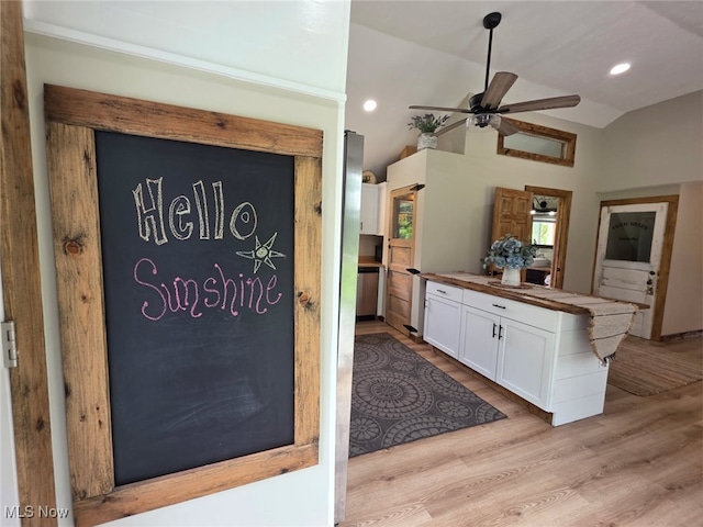 12779 State Route 700, Hiram, OH 44234 - kitchen with white cabinets, ceiling fan, wooden counters, light wood-style flooring, and vaulted ceiling