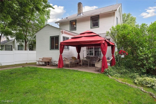 348 E Broad St, Newton Falls, OH 44444 - rear view of house with a gazebo, a chimney, and a patio