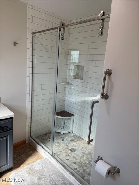 203 Park Ave, Middlebourne, WV 26149 - bathroom with a stall shower, tile patterned floors, and vanity
