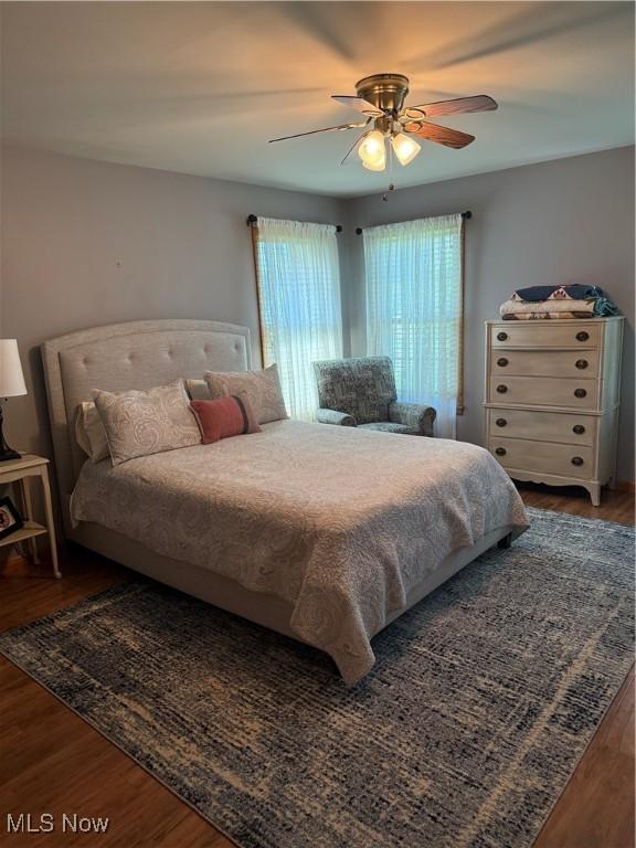 203 Park Ave, Middlebourne, WV 26149 - bedroom with wood finished floors and a ceiling fan