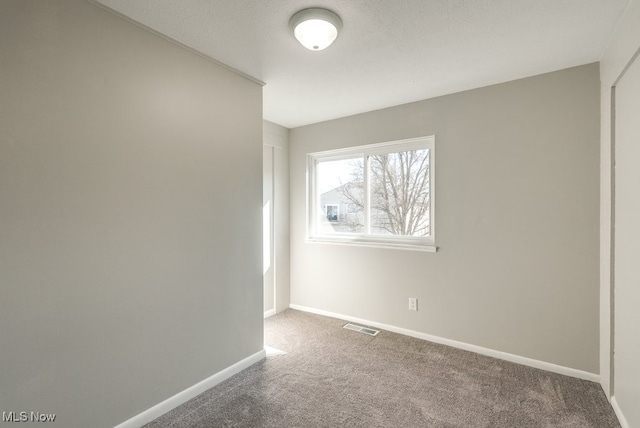 2401 Island Dr Unit 20D, Uniontown, OH 44685 - carpeted empty room featuring baseboards