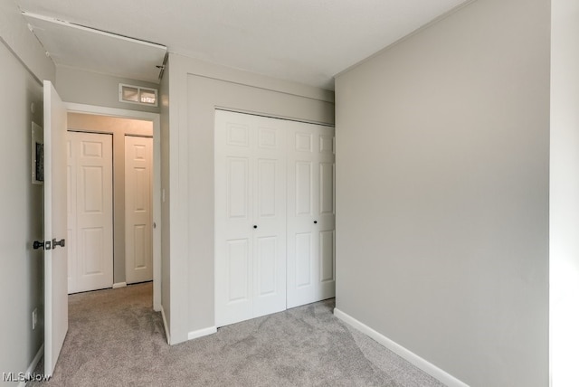 2401 Island Dr Unit 20D, Uniontown, OH 44685 - unfurnished bedroom featuring carpet flooring and a closet