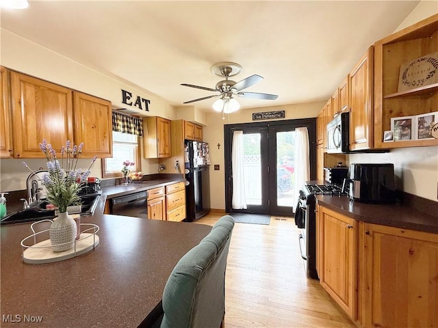 3522 Oakdale Ave, Lorain, OH 44055 - kitchen with black appliances, healthy amount of natural light, a ceiling fan, and dark countertops