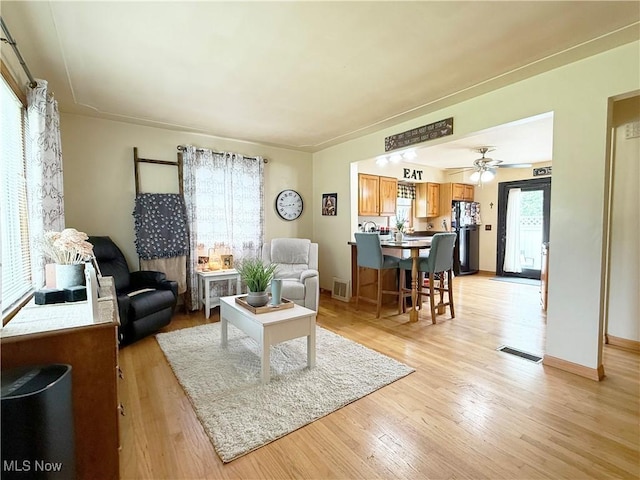 3522 Oakdale Ave, Lorain, OH 44055 - living room with light wood-style flooring and ceiling fan