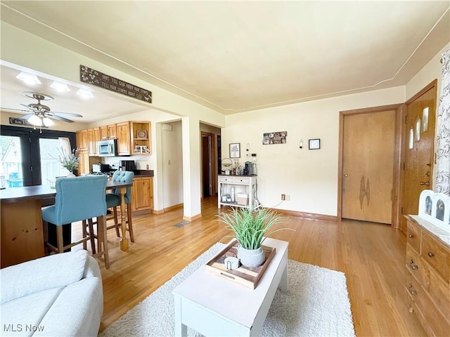 3522 Oakdale Ave, Lorain, OH 44055 - living room featuring light wood-style flooring and ceiling fan