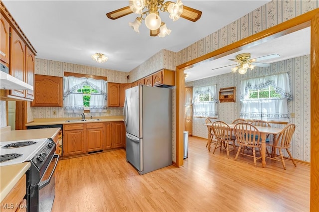 93 Olalla Ave, Tallmadge, OH 44278 - kitchen featuring wallpapered walls, freestanding refrigerator, a ceiling fan, light wood finished floors, and light countertops