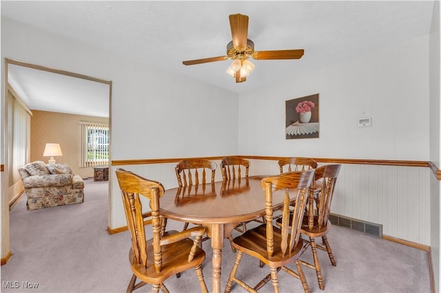 93 Olalla Ave, Tallmadge, OH 44278 - carpeted dining area with a ceiling fan and baseboards