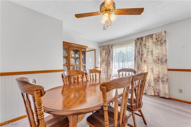 93 Olalla Ave, Tallmadge, OH 44278 - dining area featuring a textured ceiling, carpet flooring, and a ceiling fan