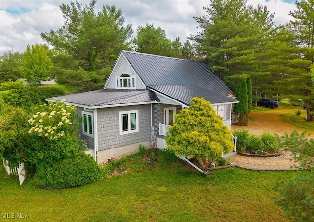 9246 State Route 555, Cutler, OH 45724 - view of property exterior featuring a lawn and a metal roof