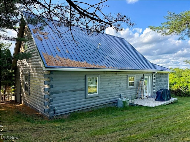 9246 State Route 555, Cutler, OH 45724 - back of house with log siding, a metal roof, a yard, and a patio area