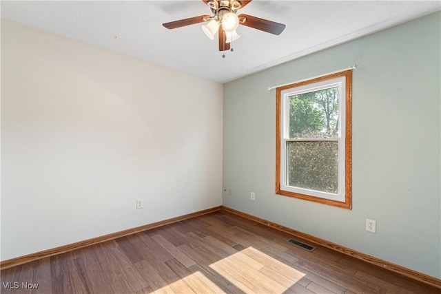 7298 Stonehill Ave NW, Canal Fulton, OH 44614 - unfurnished room featuring wood finished floors and a ceiling fan