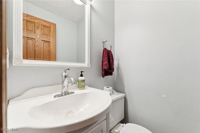 3594 Heckman St NW, Uniontown, OH 44685 - bathroom featuring vanity and toilet