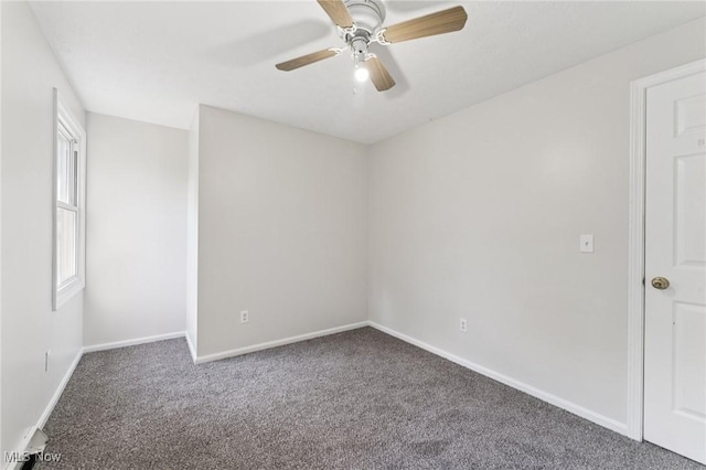 3594 Heckman St NW, Uniontown, OH 44685 - carpeted empty room with baseboards and a ceiling fan