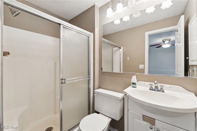 3594 Heckman St NW, Uniontown, OH 44685 - bathroom with a shower stall, vanity, ceiling fan, and a textured ceiling