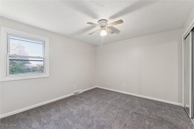 3594 Heckman St NW, Uniontown, OH 44685 - empty room featuring carpet and ceiling fan