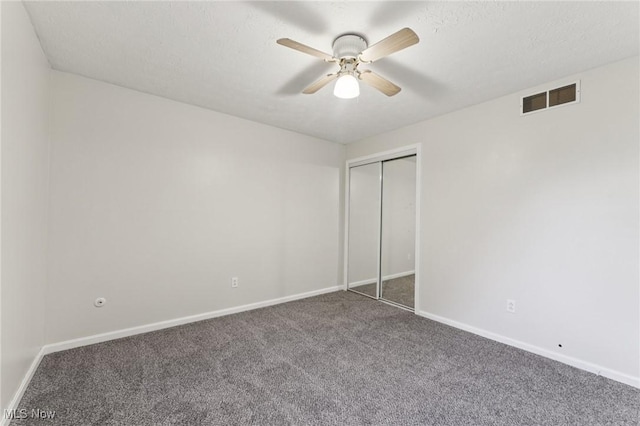 3594 Heckman St NW, Uniontown, OH 44685 - unfurnished bedroom featuring carpet floors, a closet, and a ceiling fan