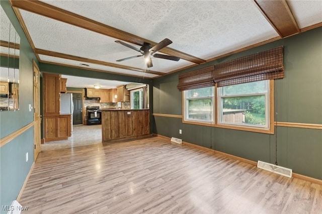 3594 Heckman St NW, Uniontown, OH 44685 - unfurnished living room featuring light wood-style flooring, ceiling fan, a textured ceiling, and beamed ceiling