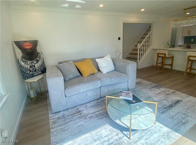 109 Avalon Ave, Bedford, OH 44146 - living area with wood finished floors, stairs, ornamental molding, and recessed lighting