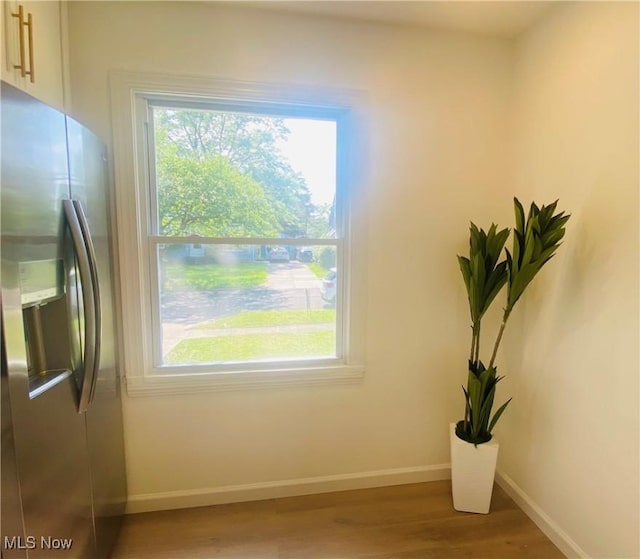 109 Avalon Ave, Bedford, OH 44146 - detailed view of stainless steel fridge with ice dispenser and wood finished floors