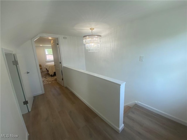 109 Avalon Ave, Bedford, OH 44146 - hallway with an upstairs landing, wood finished floors, and a chandelier