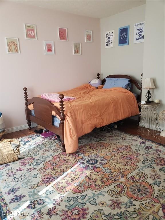 1310 Oxbow Rd, Belpre, OH 45714 - bedroom featuring baseboards and wood finished floors