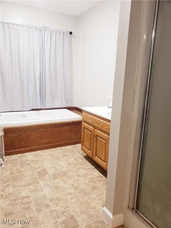 1310 Oxbow Rd, Belpre, OH 45714 - bathroom with vanity, a bath, and an enclosed shower