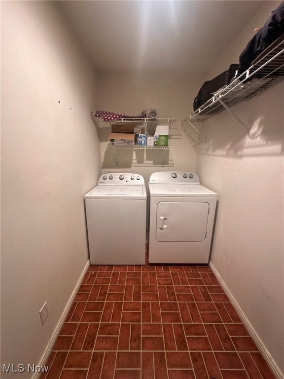 1310 Oxbow Rd, Belpre, OH 45714 - washroom with separate washer and dryer and brick patterned floors