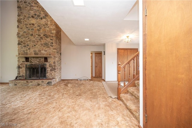 3355 Waterford Rd, New Waterford, OH 44445 - unfurnished living room with carpet, a fireplace, and stairway
