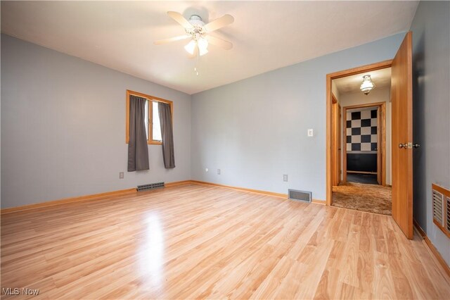 3355 Waterford Rd, New Waterford, OH 44445 - spare room featuring light wood finished floors and a ceiling fan