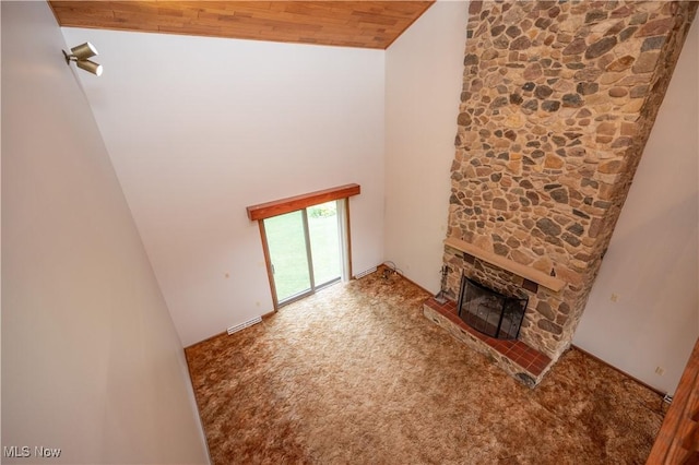 3355 Waterford Rd, New Waterford, OH 44445 - unfurnished living room featuring carpet flooring, a fireplace, high vaulted ceiling, and wood ceiling