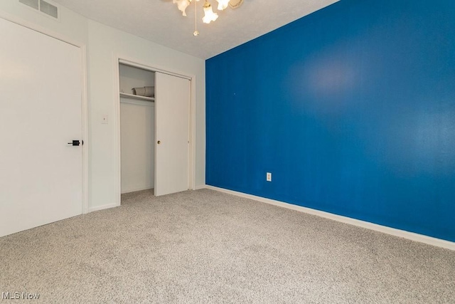 3 Meadowlawn Dr Unit 13, Mentor, OH 44060 - unfurnished bedroom featuring carpet floors, a closet, and a ceiling fan