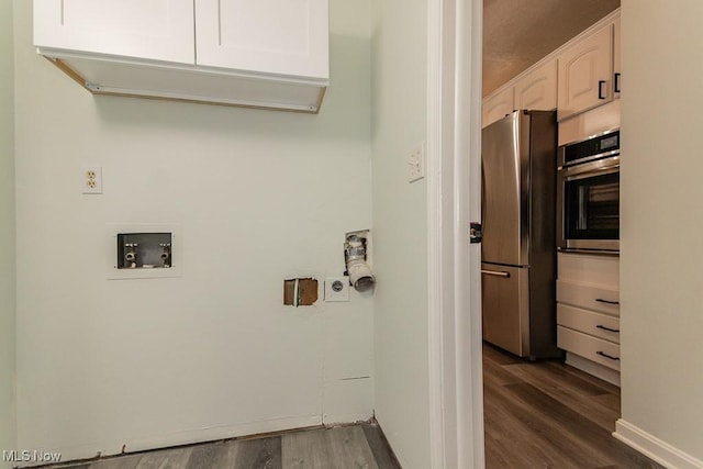 3 Meadowlawn Dr Unit 13, Mentor, OH 44060 - laundry room featuring dark wood finished floors, cabinet space, and hookup for a washing machine