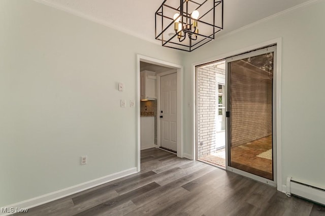 3 Meadowlawn Dr Unit 13, Mentor, OH 44060 - unfurnished dining area with a baseboard heating unit, ornamental molding, dark wood-style floors, and a chandelier