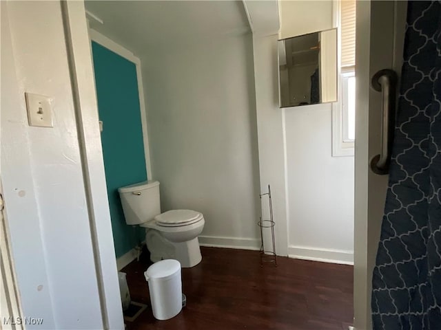 4313 Warner Rd, Cleveland, OH 44105 - bathroom featuring wood finished floors and toilet