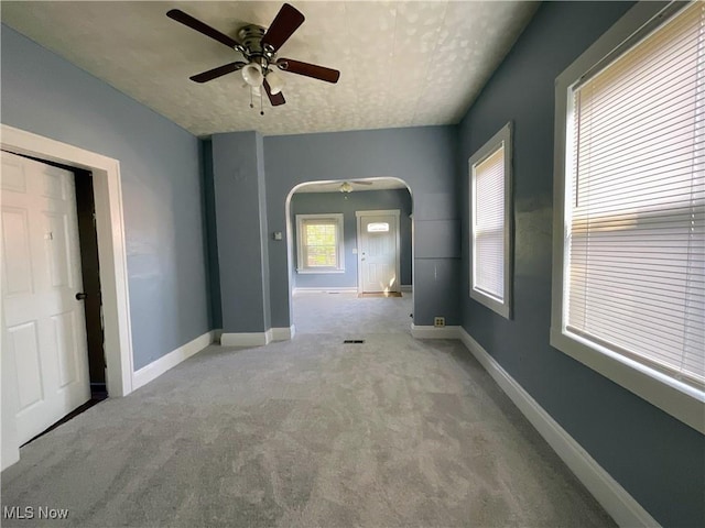 4313 Warner Rd, Cleveland, OH 44105 - carpeted spare room featuring ceiling fan and arched walkways