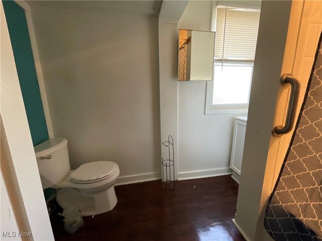 4313 Warner Rd, Cleveland, OH 44105 - bathroom with toilet and wood finished floors
