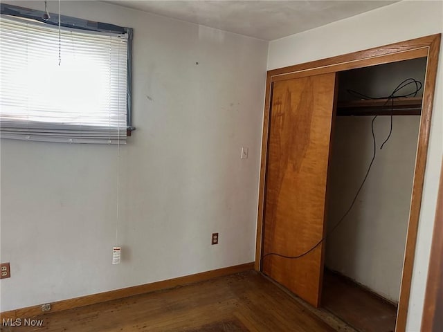 816 W 22nd St, Lorain, OH 44052 - unfurnished bedroom with wood finished floors and a closet
