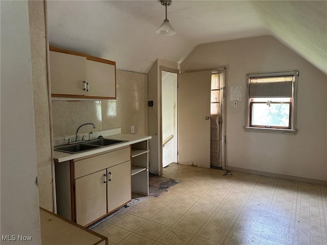 816 W 22nd St, Lorain, OH 44052 - kitchen featuring light countertops, vaulted ceiling, open shelves, pendant lighting, and white cabinetry