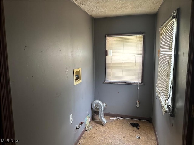 816 W 22nd St, Lorain, OH 44052 - laundry area with a textured ceiling, washer hookup, and plenty of natural light