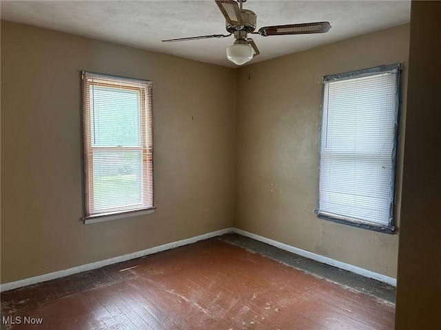 816 W 22nd St, Lorain, OH 44052 - spare room featuring wood-type flooring and a ceiling fan
