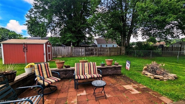 6323 Olive Ave, North Ridgeville, OH 44039 - fenced backyard with a patio area, a shed, and an outdoor fire pit