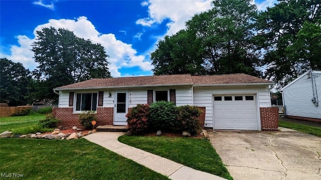 6323 Olive Ave, North Ridgeville, OH 44039 - ranch-style house with concrete driveway, brick siding, and a garage