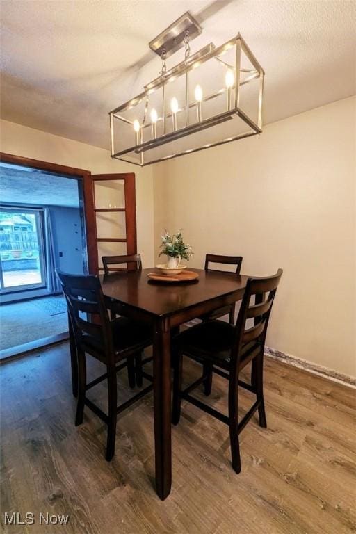 6323 Olive Ave, North Ridgeville, OH 44039 - dining room with wood finished floors and a chandelier
