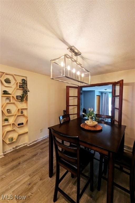 6323 Olive Ave, North Ridgeville, OH 44039 - dining space with a textured ceiling and wood finished floors