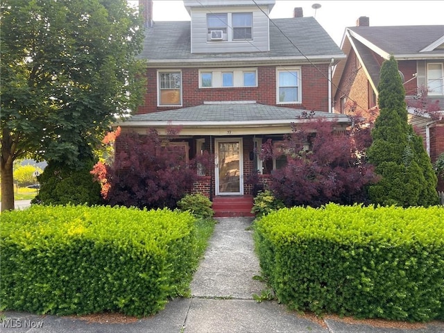 59 Rhoda Ave, Youngstown, OH 44509 - american foursquare style home with brick siding and a porch