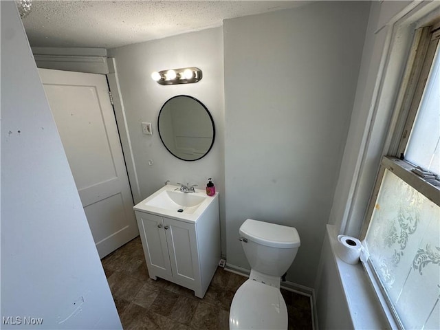 841 Kling St, Akron, OH 44311 - half bathroom with vanity and a textured ceiling