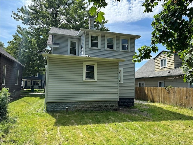 841 Kling St, Akron, OH 44311 - rear view of house with a chimney