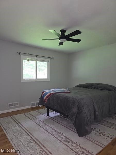 7957 Pamela Dr, North Royalton, OH 44133 - bedroom with wood finished floors and ceiling fan