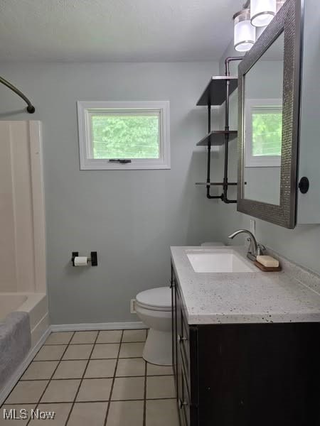 7957 Pamela Dr, North Royalton, OH 44133 - bathroom featuring plenty of natural light, vanity, tub / shower combination, and tile patterned floors